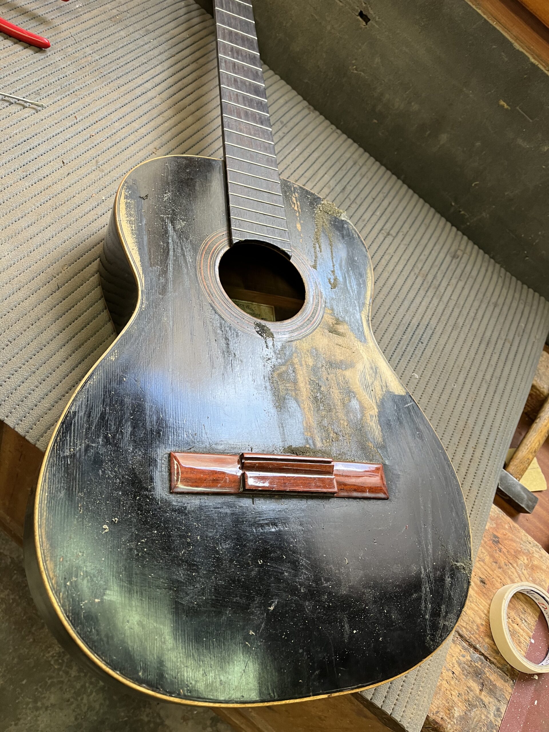 1933 José Ramírez guitar covered in black paint before restoration