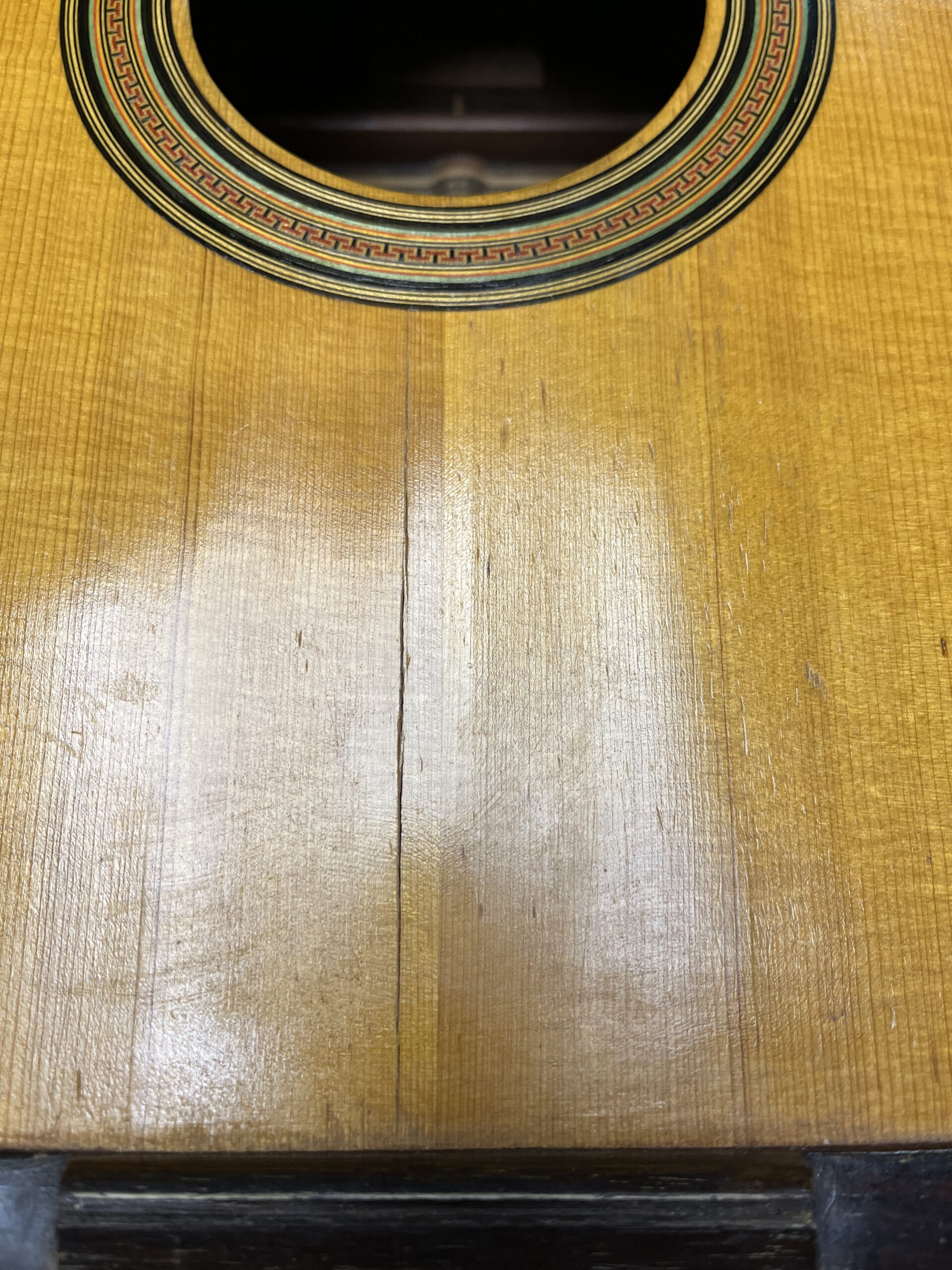 Structural break and displacement in the soundboard of the Santos Hernández Spanish guitar