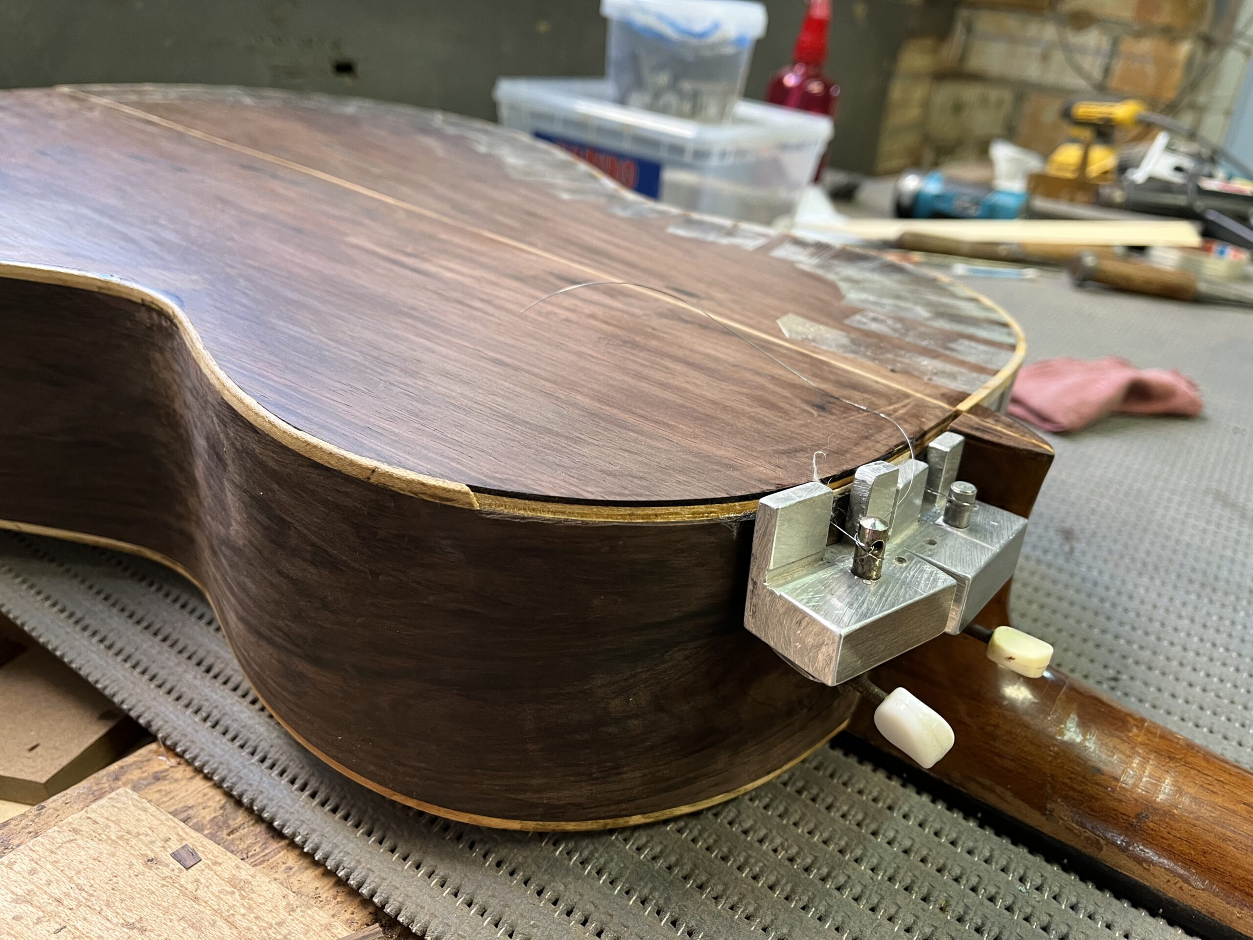 Internal pressure system used to reglue the side of a historic guitar