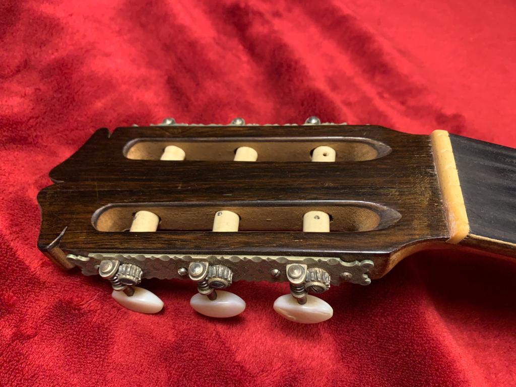 Removing and cleaning the original braces during the guitar restoration