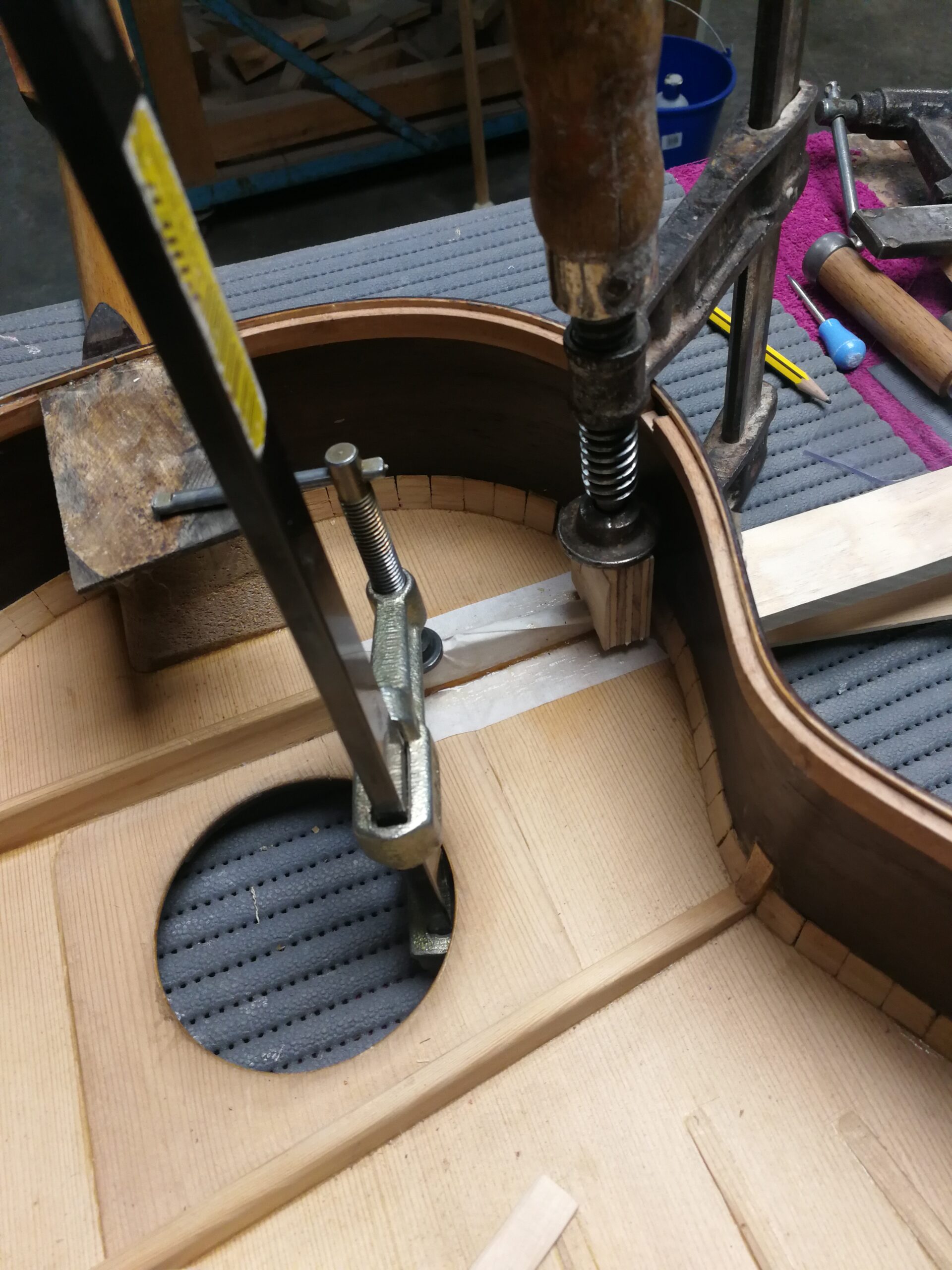 Regluing an original brace during the Marcelo Barbero restoration
